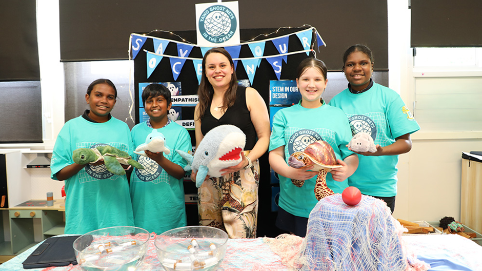 Australian of the Year Dr Katrina Wruck with student inventors. The students featured have invented a device which will help locate and remove ghost nets in Australian oceans. ©Brisbane Catholic Education (2025).