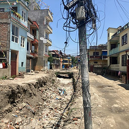 Nepalese roading and general infrastructure remains in a never ending cycle of non-completion. Nepal’s road to uncertainty: political dysfunction and development failure Nepal finds itself at a crossroads—struggling to move forward while weighed down by economic fragility, political instability, and deep-rooted corruption. What might appear on the surface as a nation hampered by suspended foreign aid and slow infrastructure progress is in fact a complex crisis touching every corner of public life. While the dream of progress endures, the harsh reality for many Nepalis—particularly in remote areas—is that their hopes are being pushed further out of reach by government inaction and widespread mistrust. Economic pressures mount as confidence falls Nepal’s economic woes extend well beyond the temporary freeze of international support. Being placed on the Financial Action Task Force’s “Grey List” has delivered a blow to its financial credibility. With this label comes suspicion from investors, stricter scrutiny from international partners, and a general rise in the cost of doing business. Business owners are witnessing a decline in investment confidence and a growing sense of unease, with funds quietly leaving the country in search of more stable environments. A key pillar of the nation’s economy—remittances sent home by Nepali workers abroad—is also under threat. With global markets becoming more volatile and financial restrictions tightening, the flow of money from overseas is no longer guaranteed. Nearly a quarter of Nepal’s gross domestic product relies on this single stream of income. Meanwhile, high youth unemployment continues to drive thousands to seek work outside the country, leaving Nepal without many of its young professionals and skilled labourers. Hydropower had offered a rare opportunity for optimism. Deals with neighbouring countries such as India and Bangladesh hinted at a path to revenue and independence. Yet, political uncertainty and wavering foreign investment have begun to stall even these gains. The recent cancellation of the Millennium Challenge Corporation (MCC) grant, which included crucial funding for road and energy infrastructure, has made the challenge even steeper. Governance shortcomings deepen the crisis Though international challenges are part of the problem, Nepal’s leadership has failed to guide the country through these difficulties. Corruption remains endemic at all levels, with recent years witnessing several high-profile scandals involving top leaders. Misuse of funds, foreign aid mismanagement, and bribery allegations have sparked growing protests across the country, with citizens losing patience. Nepal’s reputation for weak governance has only worsened. Transparency International’s rankings show a deteriorating situation, and efforts to reform have often been more about consolidating power than cleaning up the system. Investigative bodies have been brought under political influence, severely weakening accountability. Public frustration is boiling over, and political division is becoming harder to repair. This crisis of leadership is also tied to the failure of Nepal’s democracy to deliver genuine change. Since the monarchy ended in 2008, the country has been controlled by a tight circle of senior political figures, cycling through power but delivering little real reform. Their inability—or unwillingness—to break the cycle of dysfunction has left many feeling disillusioned. A monarch's voice rekindles old loyalties In this climate of political failure, former King Gyanendra Shah has stepped into the spotlight once more. His call for peace and national unity, issued on Democracy Day, has touched a nerve among a public increasingly fed up with partisan politics. For some, he represents a more stable past; for others, he offers an alternative to a failing system. While many young people and historically marginalised groups reject any return to absolute rule, the monarch’s comments have triggered serious debate. His growing support signals a widespread dissatisfaction with the country’s current direction. Political parties, once quick to dismiss such voices, are now forced to respond to rising monarchist sentiment—a reflection of broader public discontent. The timing of his statement—just as reports of widespread corruption and U.S. aid suspension were emerging—added to its impact. Some leaders have brushed it off, but others recognise that calls for the monarchy’s return are a symptom of deeper problems. Public Infrastructure remains under strain in Nepal (2025) Balancing power in a contested region Nepal’s strategic position between India and China means it must tread carefully in its international dealings. It cannot afford to alienate either side, nor can it ignore pressure from Western partners such as the United States. The MCC agreement was seen by many as a step toward closer ties with the U.S., but it also drew criticism from China, which regards such moves as challenges to its Belt and Road Initiative. With American funding now on shaky ground, Nepal may lean more heavily on Chinese support—but that route carries the risk of growing debt dependency and further loss of autonomy. India, on the other hand, remains Nepal’s closest trade partner, and the shared border makes their relationship critical. Yet, many Nepalis are wary of Indian influence, particularly when deals seem to favour their southern neighbour. Some analysts warn that American aid could become a tool of leverage, with Washington expecting Kathmandu to limit its engagement with China. In response, Nepal must focus on rebuilding its domestic foundations, avoiding overreliance on any single global power, and strengthening its tradition of non-alignment. The people's voice grows louder While politicians argue and alliances shift, ordinary Nepalis have taken to the streets. Discontent is rising across social classes and age groups. Students, small business owners, and professionals alike are calling for a new direction—one built on fairness, transparency, and effective leadership. The government’s heavy-handed reaction to public protest has only fuelled more anger. Online restrictions, police crackdowns, and widespread arrests have painted a troubling picture of a government losing touch with its people. Unless real reforms are introduced soon, Nepal risks a slide into even greater instability. Development derailed by corruption and delay The roading crisis is just one example of how corruption has infected everyday life. While the opening of roads has brought real benefits—reducing isolation, saving lives, and opening new economic opportunities—the process has often been plagued by dishonest practices. On one hand, new roads could transformed remote communities, yet, such gains are overshadowed by reports of stalled projects and misused resources. A recent government investigation revealed that the new Pokhara international airport, built by a Chinese state contractor, was riddled with irregularities. Poor construction, unpaid taxes, and inflated costs are just some of the issues linked to corruption and weak oversight. The contractor, China CAMC Engineering Co., is accused of delivering substandard work and prioritising its own profits over Nepal’s needs. Nepal’s public services are riddled with similar problems. Companies often face demands for bribes just to secure basic utility connections. Getting a construction permit or an investment licence is slow and unpredictable, largely due to bureaucracy and changing rules. Starting a business in Nepal is costlier than in other South Asian countries. Even the tax and customs systems are mired in inefficiency and exploitation. Officials in these sectors are often known to accept or demand bribes, while businesses must spend excessive time navigating a complicated tax process. Meanwhile, large companies use questionable tactics to avoid paying what they owe. Public procurement is another high-risk area. Most companies expect to offer gifts or payoffs to win government contracts, and reports of misallocated funds are frequent. Cartels and political favours determine who gets public projects, despite legal requirements for fair bidding. High-profile cases consistently demonstrate how deeply corruption is embedded. Pokhara, Nepal. The economic opportunity of tourism is under-utilized by persistent corruption Conclusion Nepal’s current troubles go far beyond a road crisis. They are the result of broken systems, poor leadership, and a failure to deliver on promises of democracy and development. Without decisive reforms to root out corruption, build trust, and boost economic opportunity, Nepal risks falling even further behind. The path forward will not be easy, but it is necessary. By investing in stronger institutions, supporting local industries, and restoring public faith in governance, Nepal can begin to rebuild. Roads may connect towns and villages—but only transparency, accountability, and vision can reconnect a nation with its future. #Nepal #Nepalroadingcorruption