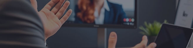 picture wider than it is tall of a Virtual consultation. Man wearing suit with only forear