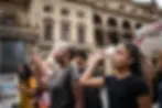 Two Black women protest, raised fist, sign "TODAY IS BETTER THAN TOMORROW".