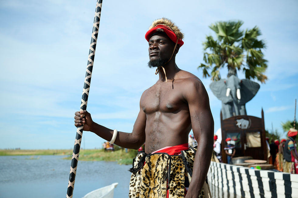 Lozi paddler Tebuho Mundia wearing Heritage Furs next to the King’s barge at the 2025 Kuomboka Festival in Zambia. Credit: Roger Jardine/Panthera