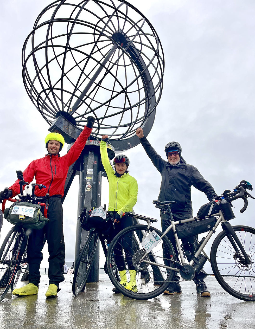 The event concluded at the Arctic Circle. Tom Millward (right) celebrates with fellow cyclists. Photo 1-6 credit: Provided by Tom Millward