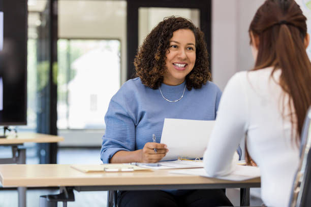 Woman providing career consultation to a young girl