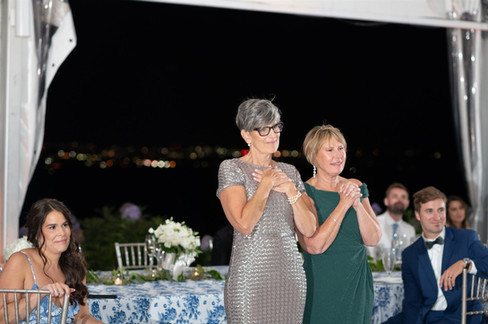 Moms watching first dance of bride and groom
