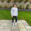 Thumbnail: Brunette woman standing on a patio wearing a sweatshirt and leggings