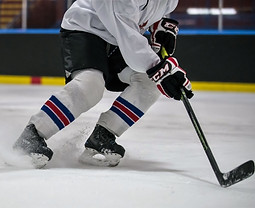 Hockey-close-up-skates-and-snow-1-705x481.jpg
