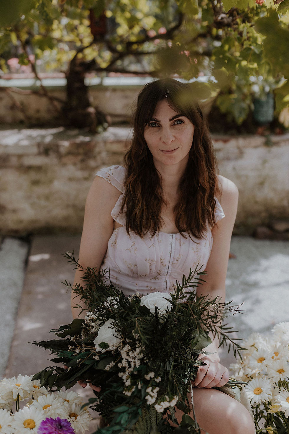 wedding business owner holding bouquet of preserved flowers