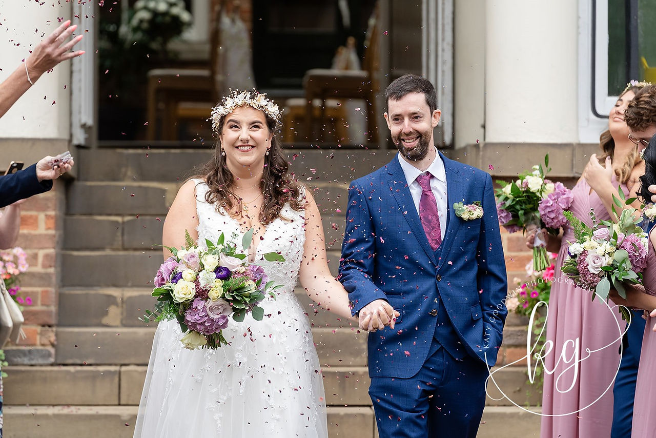 Confetti throwing at bride and groom at St Chads College Durham