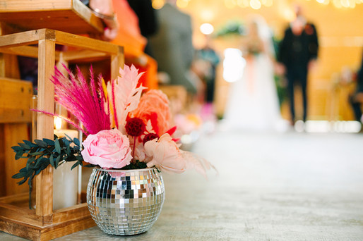 discoball wedding centrepieces used down aisle at Bradbury Glade