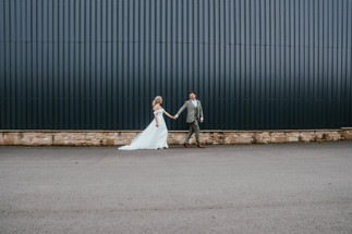 bride and groom walking at vallum farm