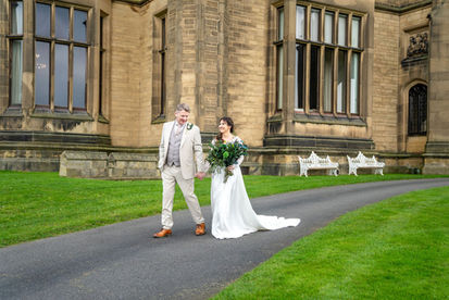 all green bouquet being carried by bride with her groom at Allerton Castle