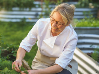 Fresh broad beans growing in a home kitchen garden, inspiring a seasonal recipe by The Natural Health Chef