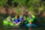 Cave tubing Belize Family floats gently downstream at Nohoch Che'en Jaguar Paw