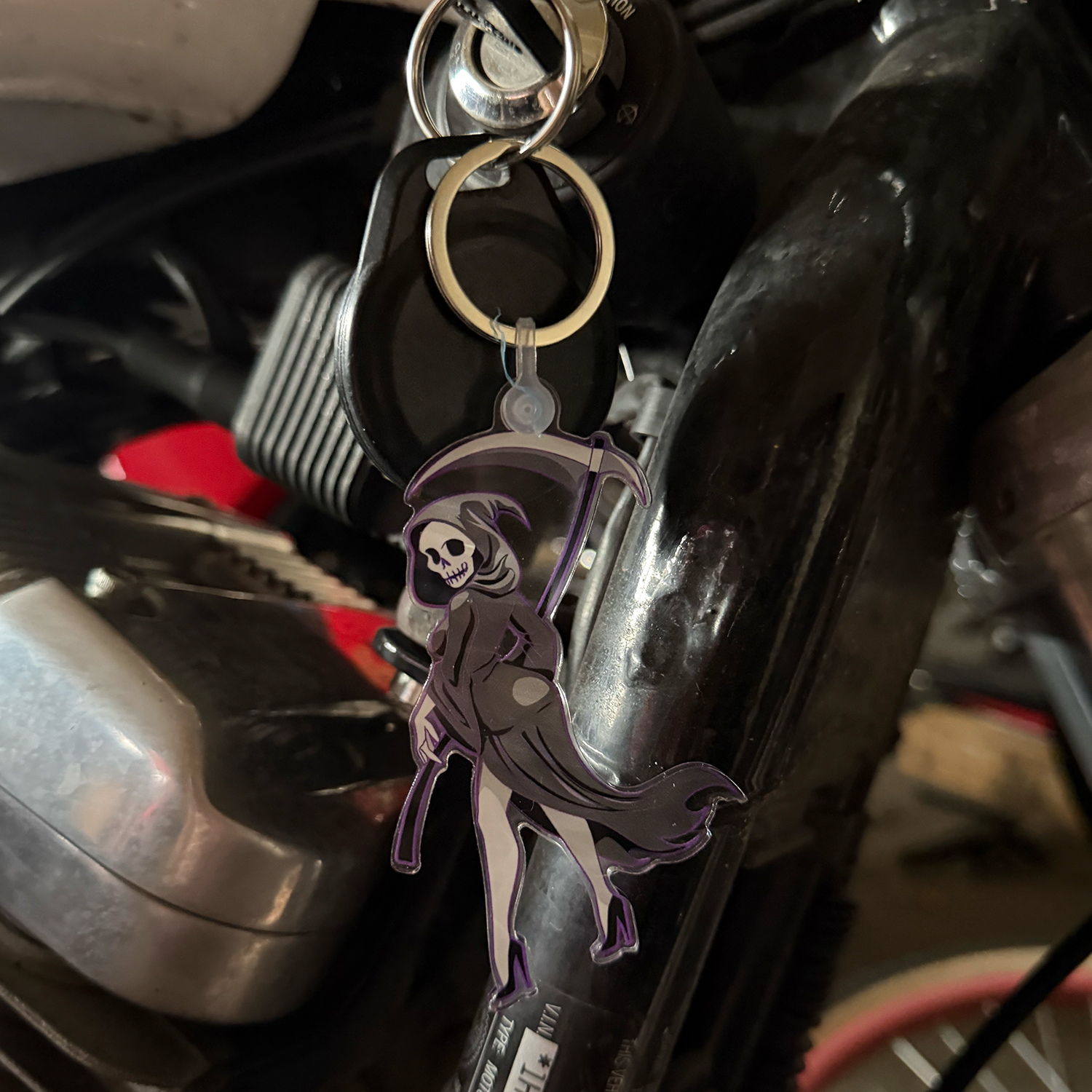 Sexy Reaper Acrylic Keychain in motorcycle ignition