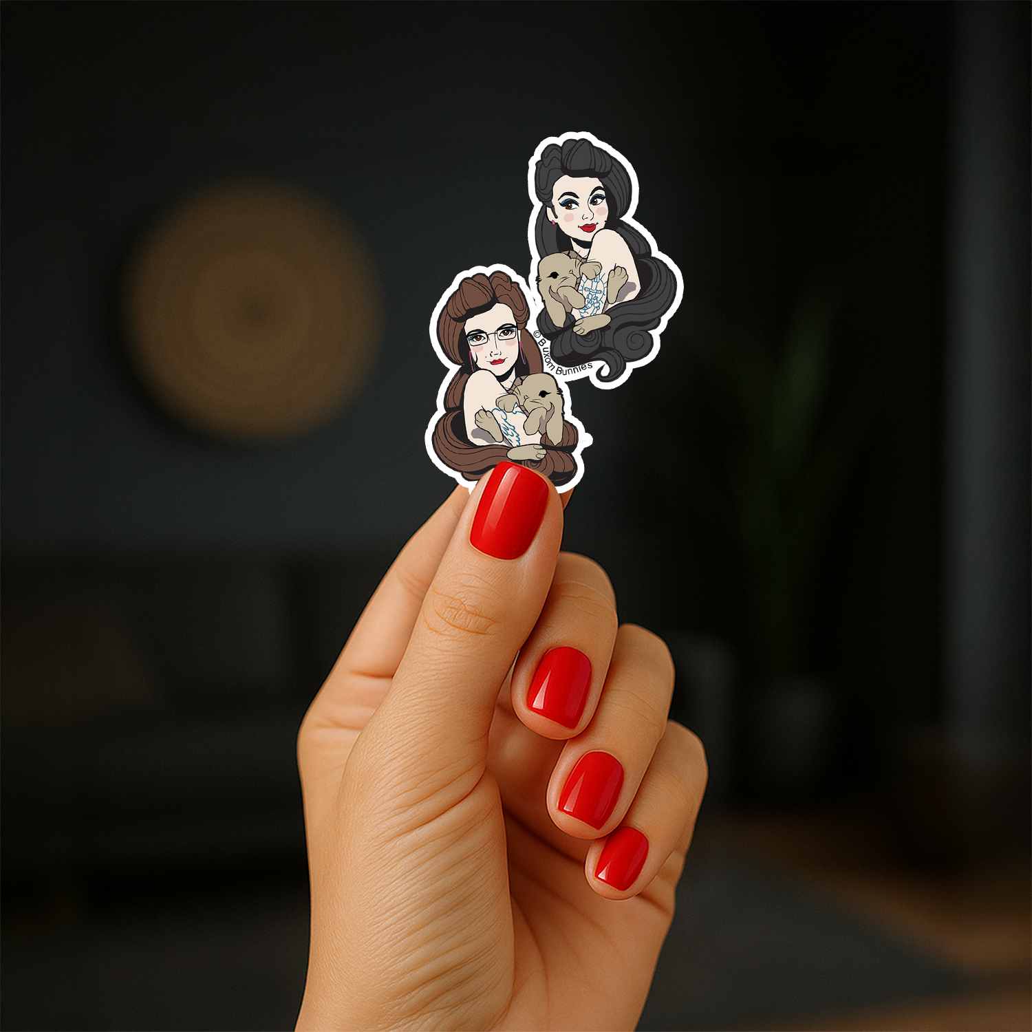 Buxom Bunnies Sticker in a hand