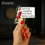 Thumbnail: Save Santa a Trip Sticker brunette option in a hand with red nail polish