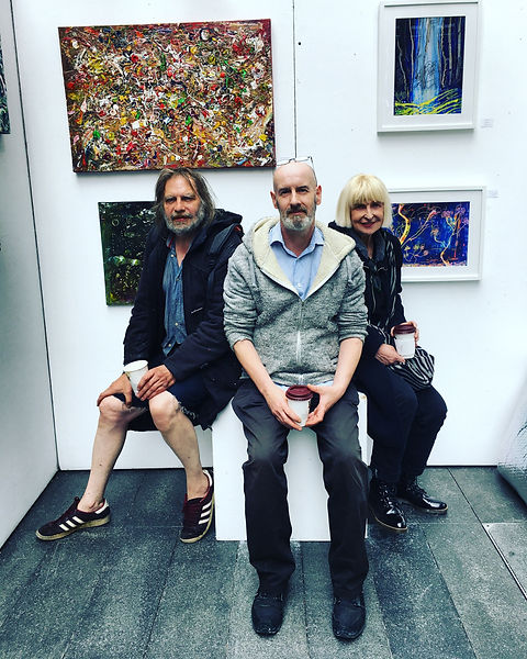 Michael, James and Geraldine sit in one of the pods provided by Spitalfields E1 market. The market is covered but temporary and we set up and take down every day for a week in September or October.