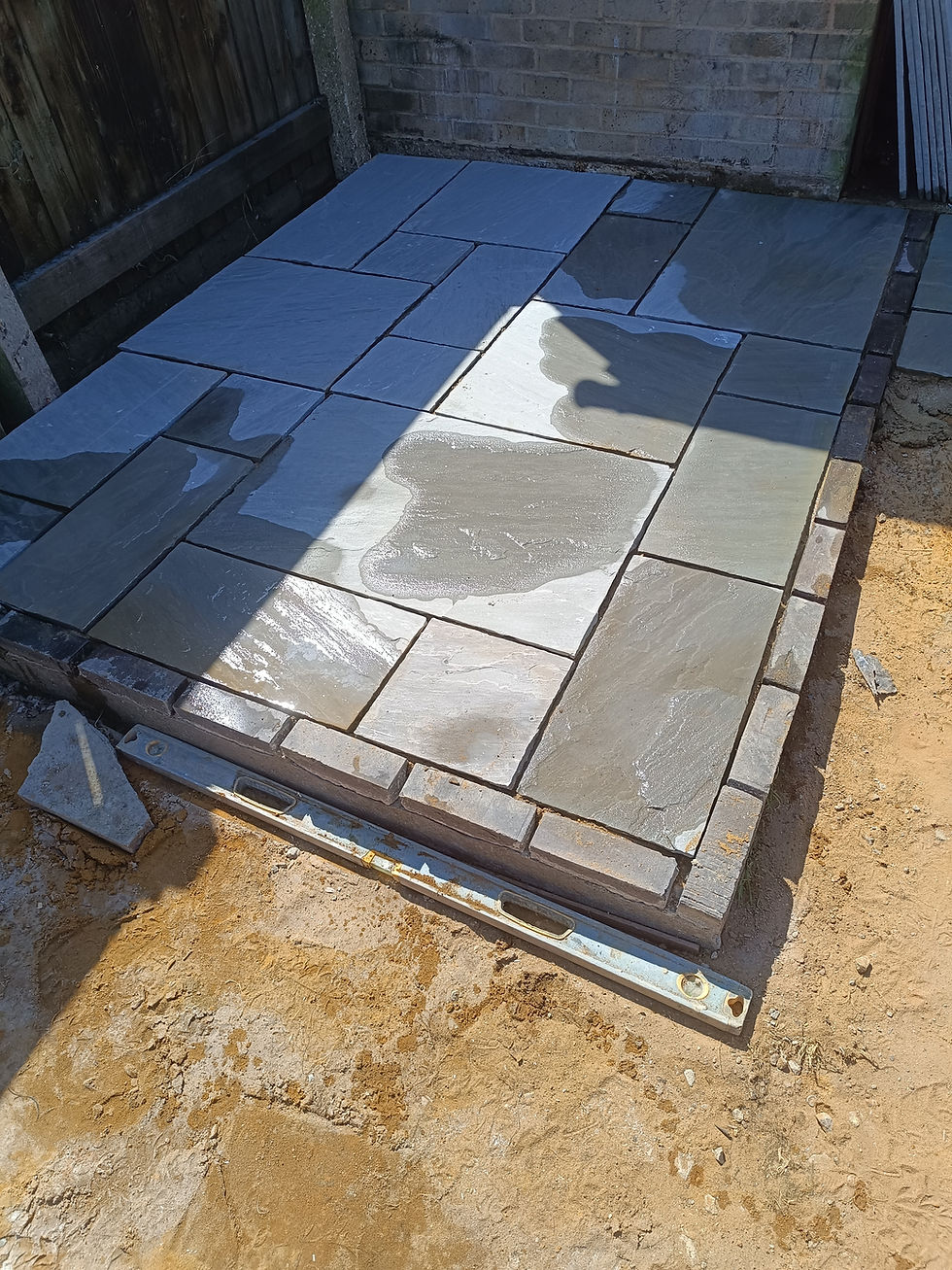 Raised Indian sandstone patio installation in progress in Bedford