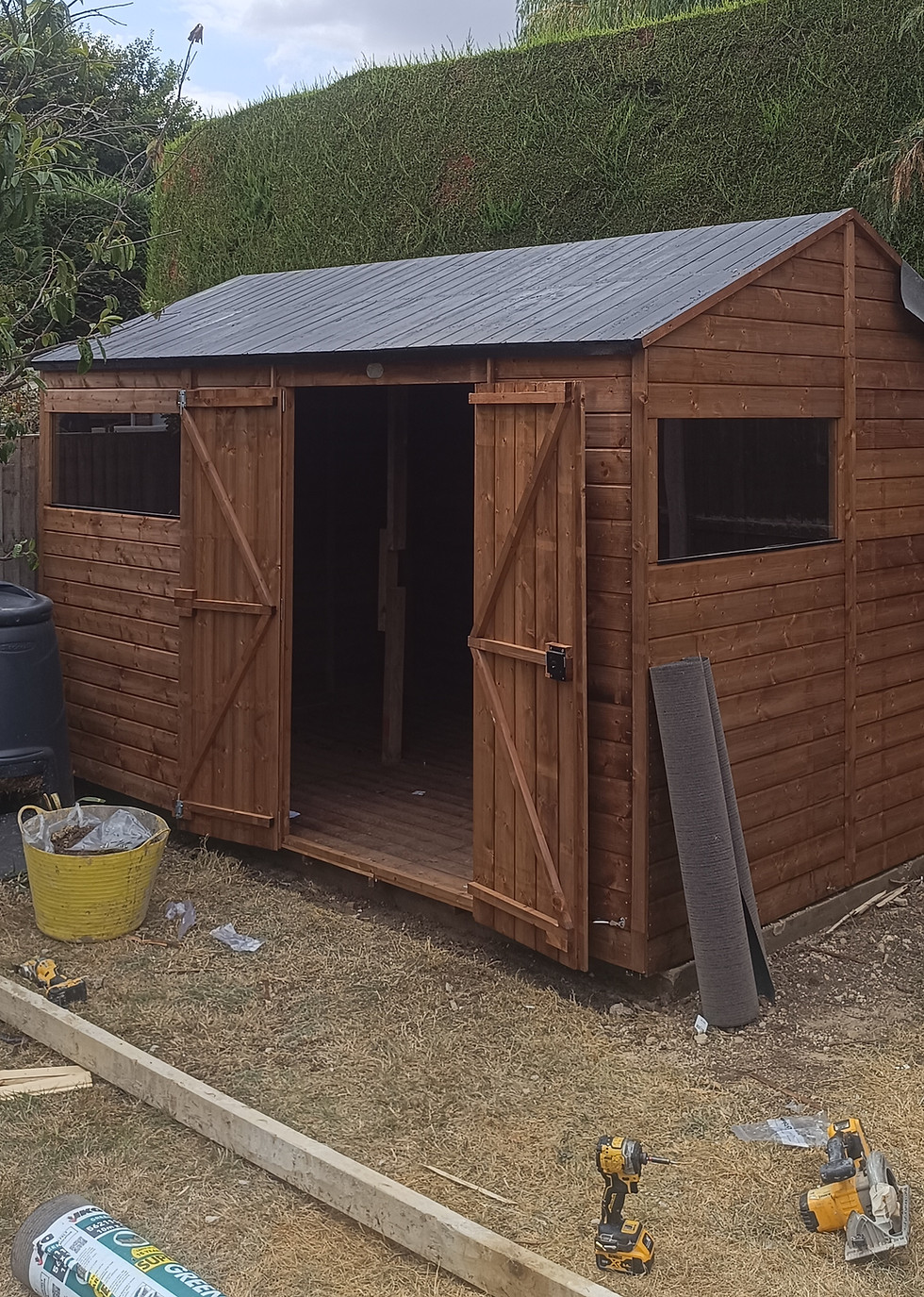 Roofing felt installation on bespoke timber garden shed in Bedford