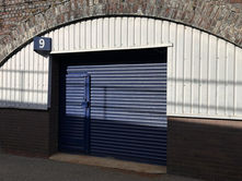 Central Removals blue shutters on archway storage in Leamington Spa.