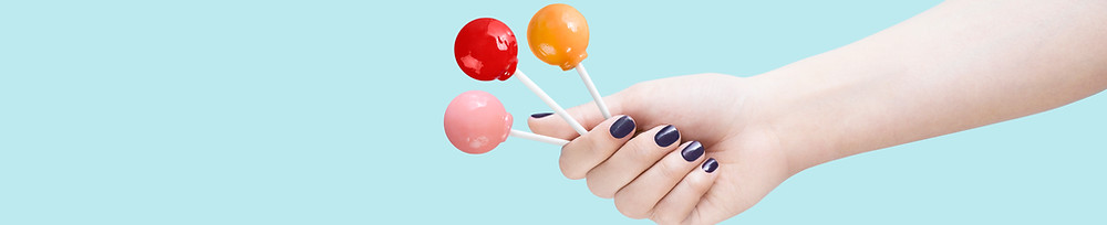 holding lolipops