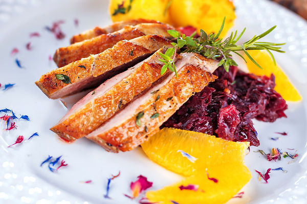 Christmas roast duck served on a festive table.jpg