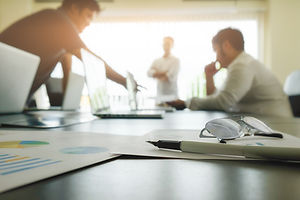 business-concept-with-copy-space-office-desk-table-with-pen-focus-and-analysis-chart-compu