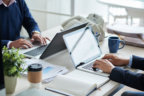 side-view-of-cropped-unrecognizable-business-people-working-at-common-desk.jpg