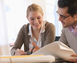 Woman HR Consultant discussing HR documents with male client