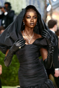 Close-up of Anok Yai’s gold tear makeup and sculptural hooded Balenciaga look at Met Gala 2026