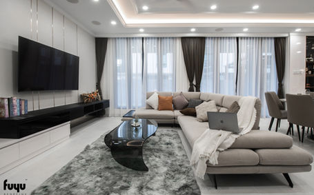 Modern living room in Johor Bahru with sectional sofa and neutral interior tones by Fuyu Dezain
