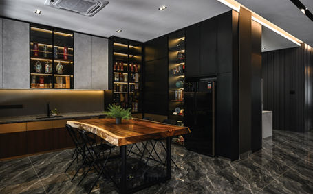 Warm-toned dining area with marble flooring and illuminated shelving at Loo’s Residence Bukit Rahman Putra.