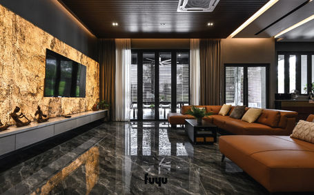 Luxurious lounge featuring illuminated textured stone TV wall and full-height glass doors at Loo’s Residence Bukit Rahman Putra.