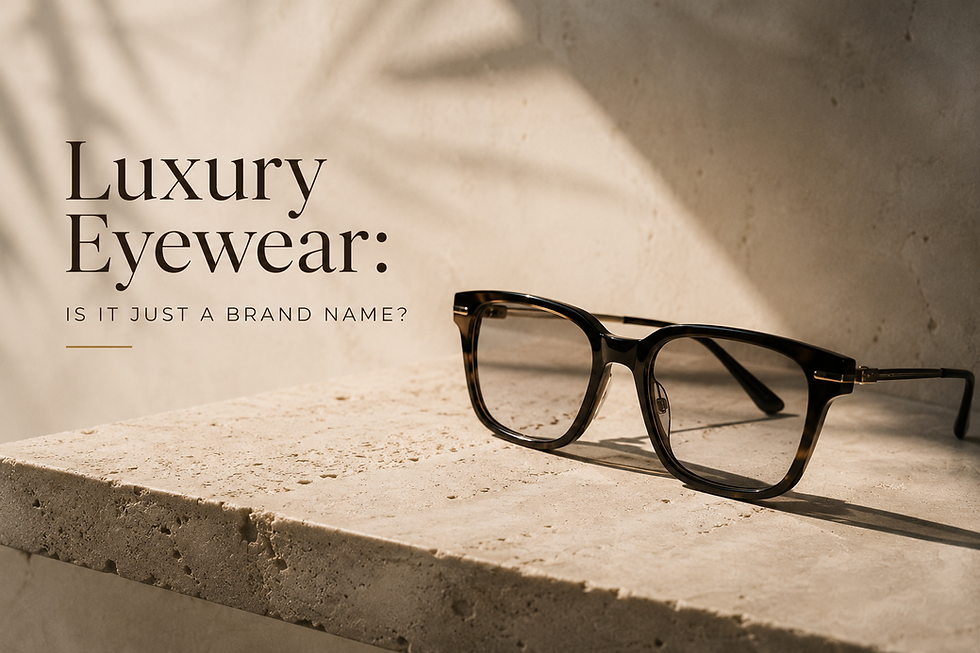 Close-up of luxury tortoiseshell eyeglass frame with gold metal hardware on stone surface