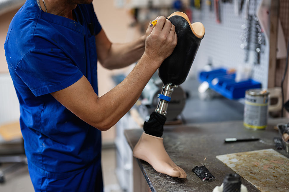 A skilled technician works meticulously on a prosthetic leg in a workshop environment, sho