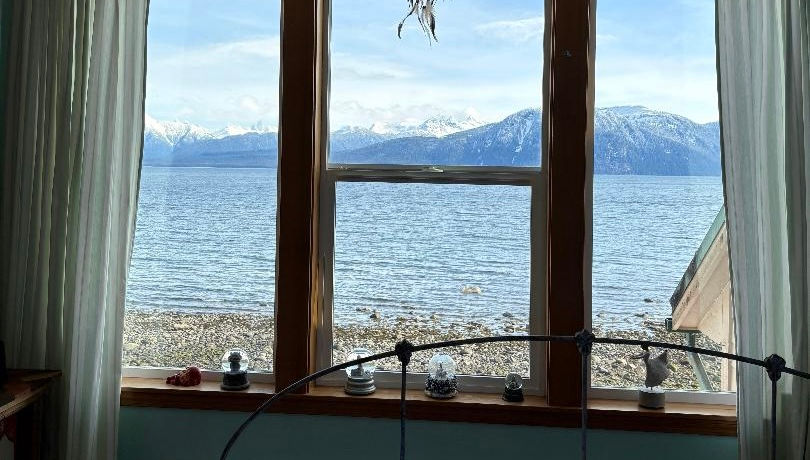 The Eagle Bedroom has a full-sized bed and a stunning view of Frederick Sound and the Coast Range.
