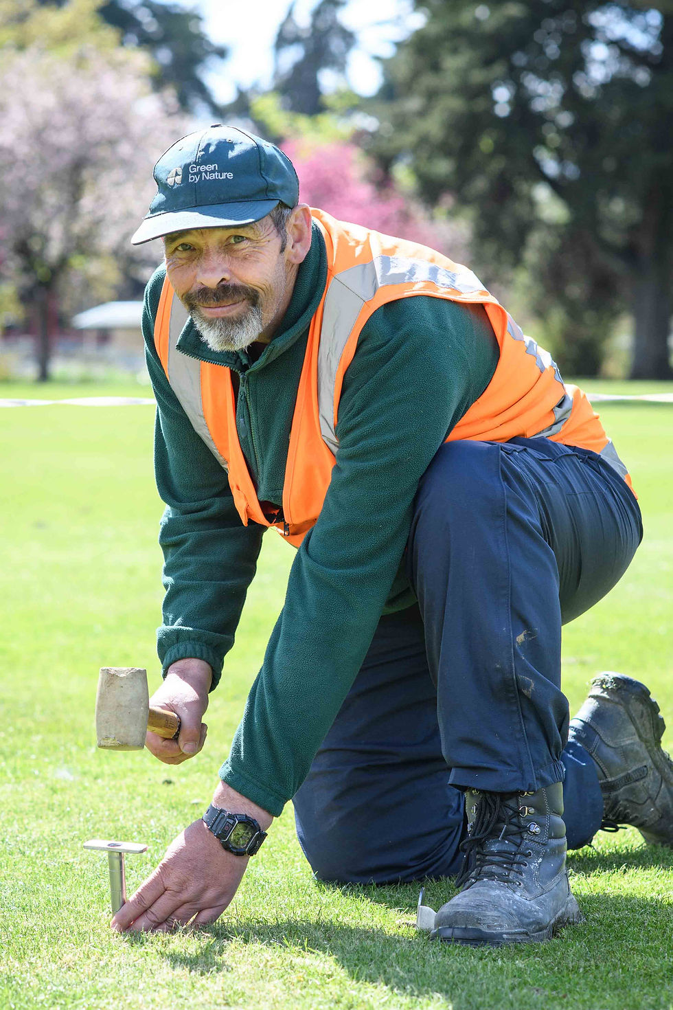 John taking a core sample to check the condition and moisture level of the wicket