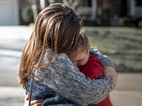 mum and child hugging goodbye