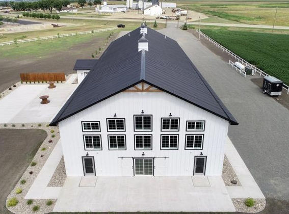 Aerial view of barn and outdoor patio ceremony space at 5 Family Ranch wedding venue in Southwest Minnesota