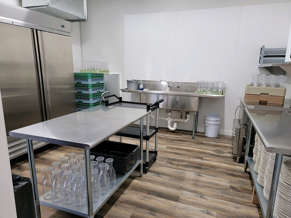 A robust stainless steel 3-sink setup for cleaning and sanitation, conveniently located in the cold prep kitchen staging area at 5 Family Ranch.