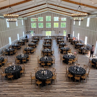 Wedding Venue near Montevideo, MN, Spacious banquet room setup for a large guest count, featuring wide aisles between tables, providing an open and comfortable atmosphere for guests.
