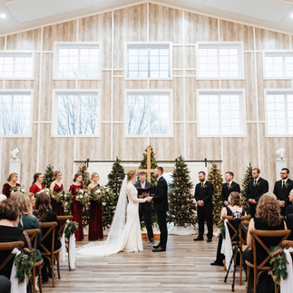 Indoor wedding ceremony with south window wall in the background