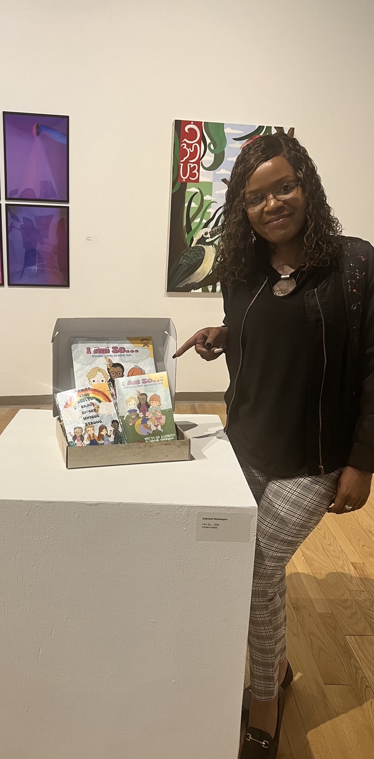 Gabrielle presenting the I AM SO toolkit in a gallery