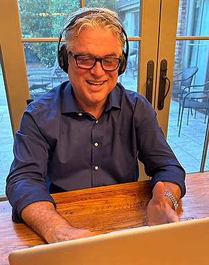 John at Computer with background.jpg
