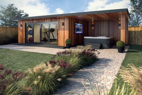 Modern timber garden room with canopy and hot tub in landscaped garden