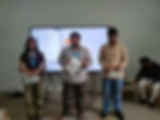 Students at Creative Cognitive Institute presenting by a digital screen