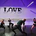 Dancers in various poses during choreography.