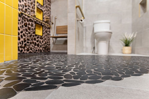 Open concept bathroom with accessible curbless shower