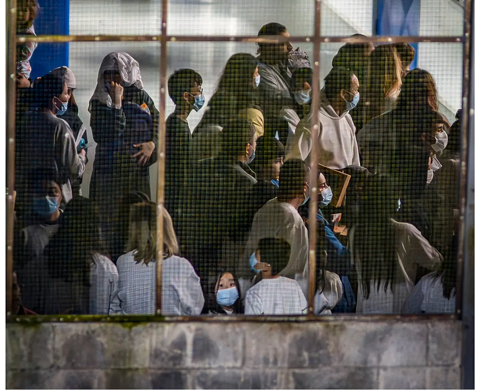Migrants deported from the United States entering a shelter in Puntarenas Province, Costa Rica