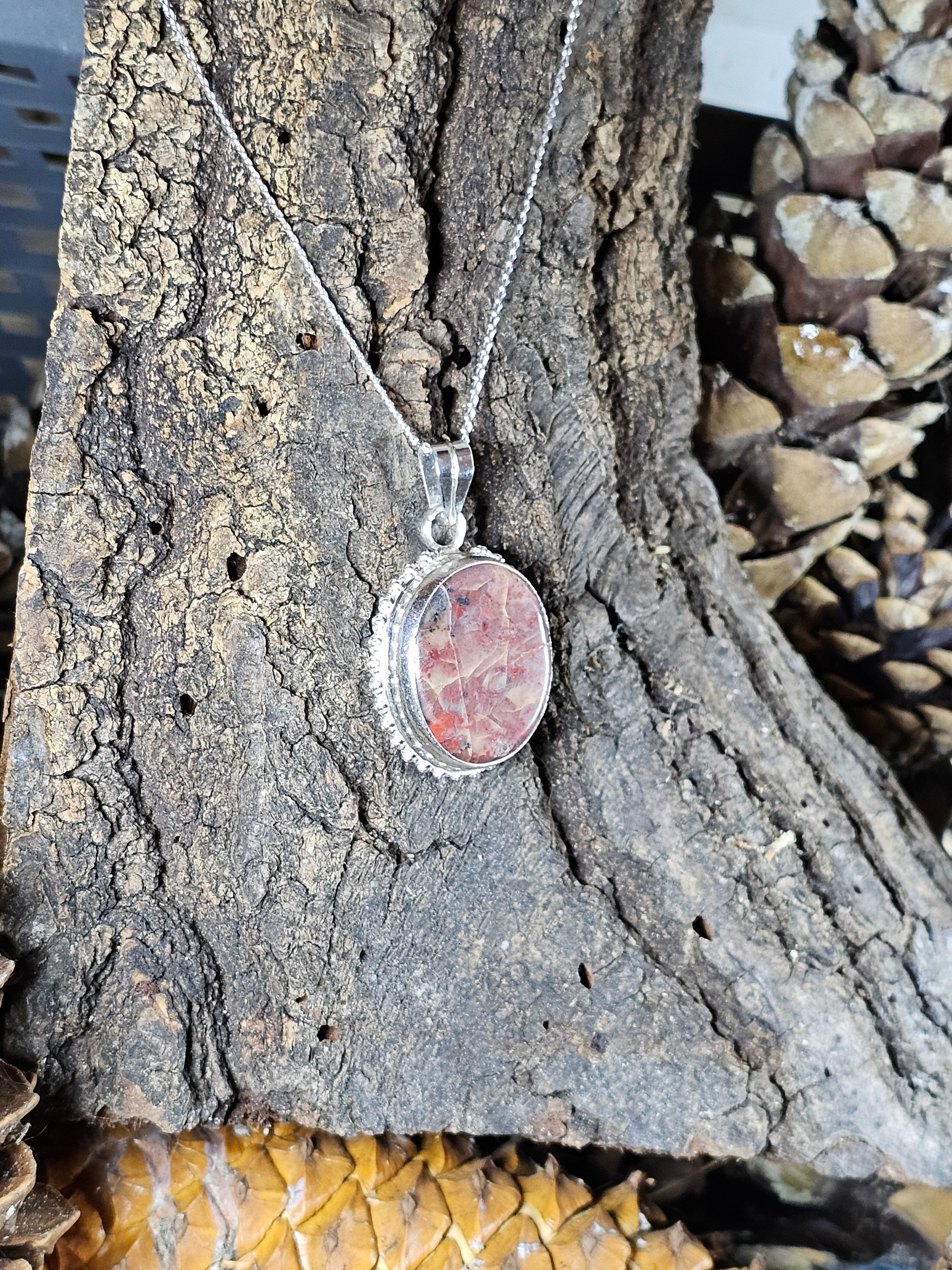 Rose edged stone pendant